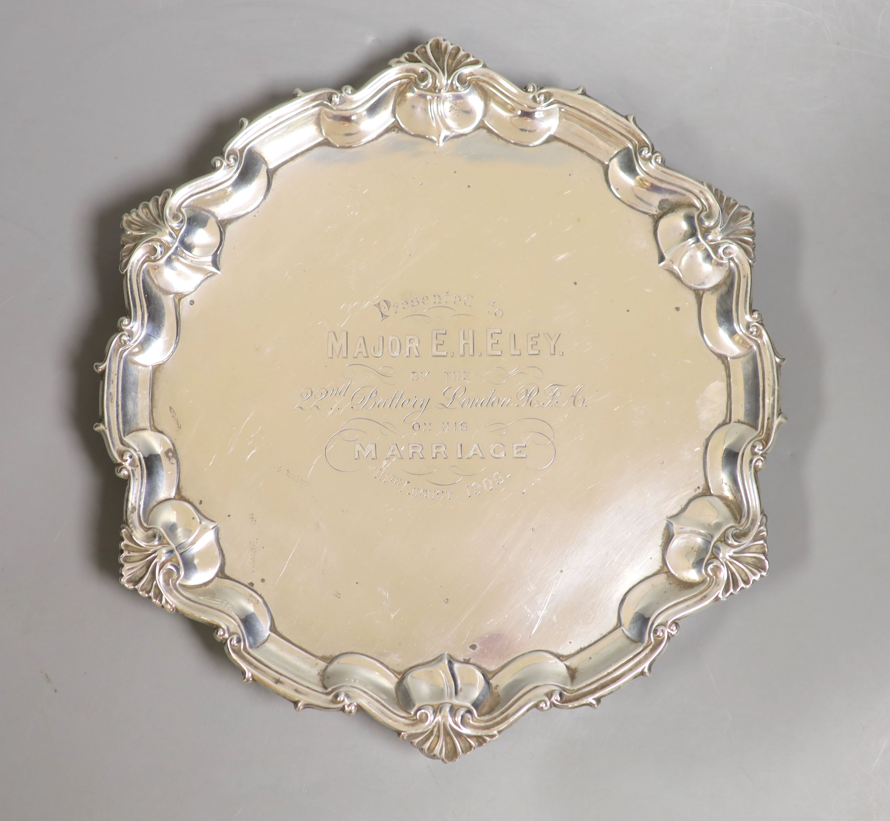 An Edwardian silver salver by William Hutton and Sons, London, 1908, with presentation inscription to major E.H Eley, by the 22nd battery London RFA on the occasion of his marriage, 26.9 cm 18.5 oz.